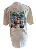 Scatter Creek Trading Co cream t-shirt featuring a graphic of a hunting dog wearing a cap with a mallard duck