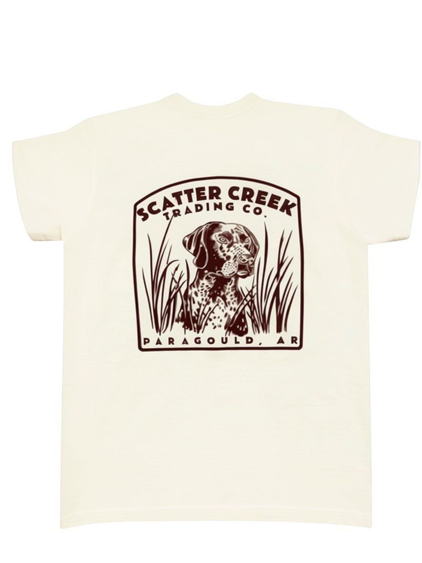 Scatter Creek Trading Co cream heavyweight cotton t-shirt featuring a brown graphic of a hunting dog in tall grass.